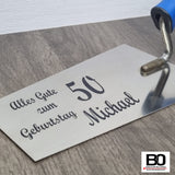 Maurerkelle mit verschiedenen Sprüchen
